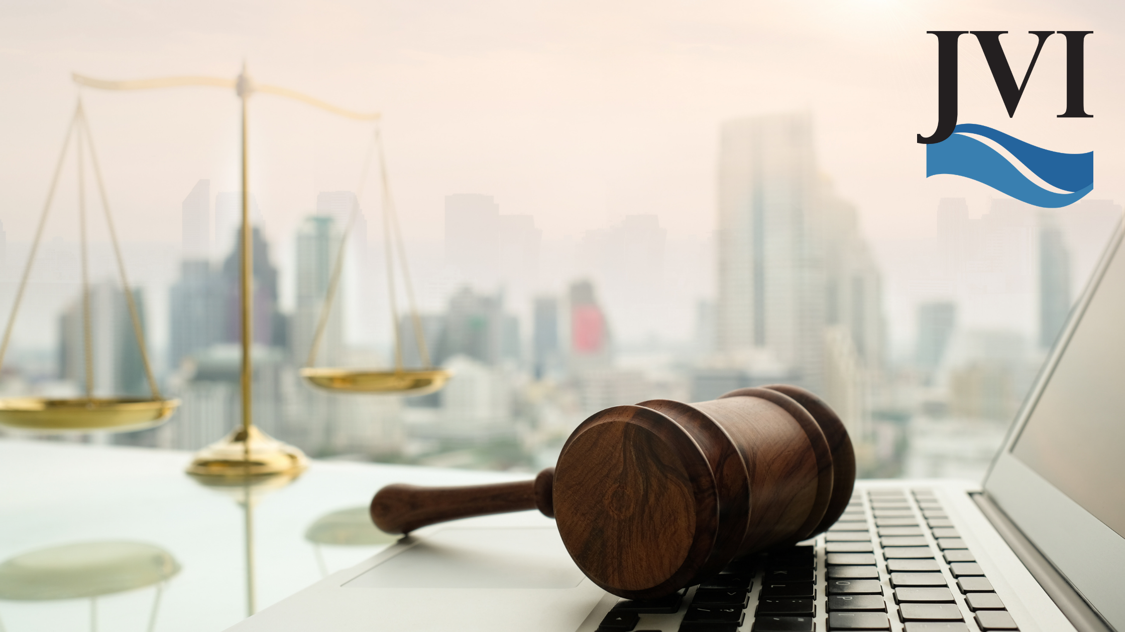 Gavel on a desk with a scale of justice