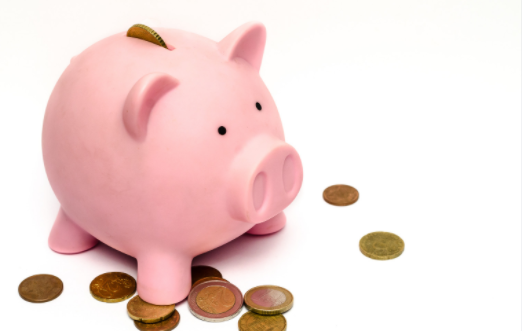 Image of a piggy bank with coins